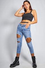 Edgy Ripped Skinny Jeans with Fishnet Layer